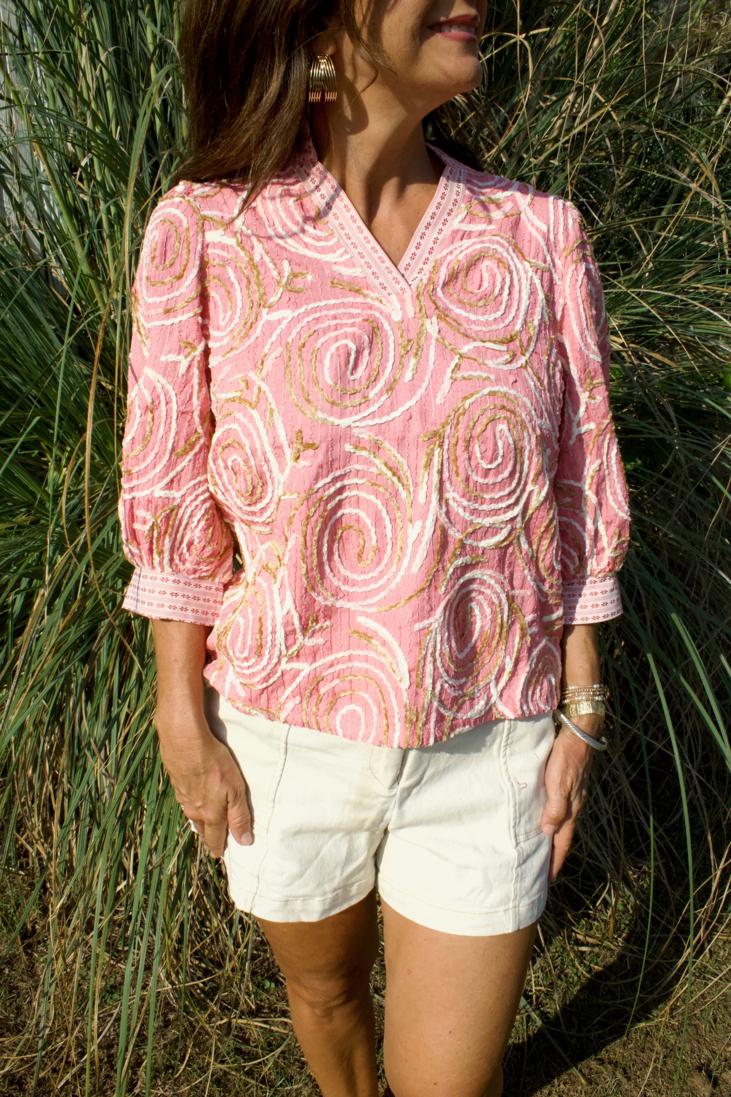 Coral swirls ruffle top