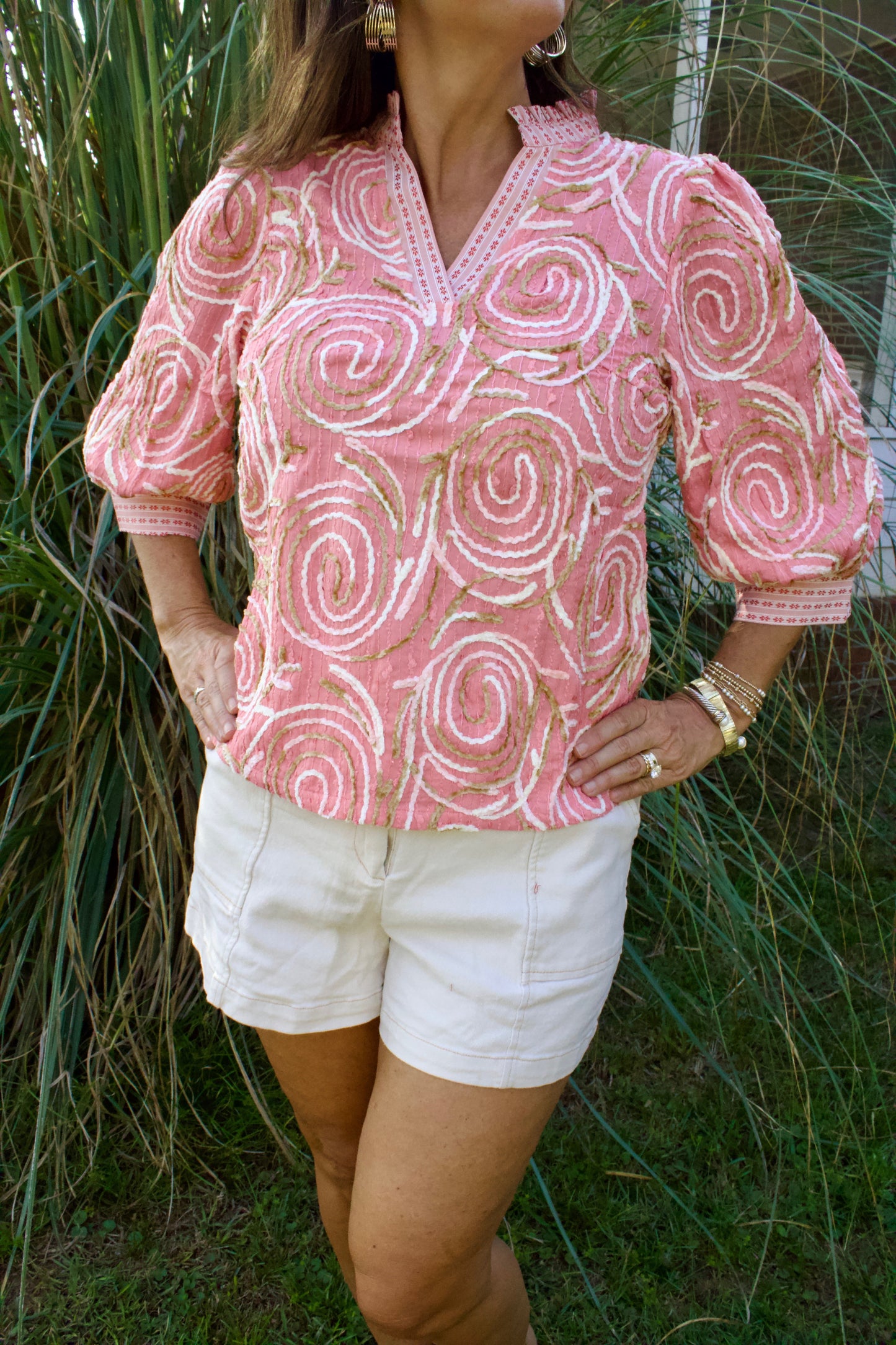 Coral swirls ruffle top